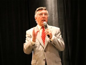 Allan Colman on stage speaking